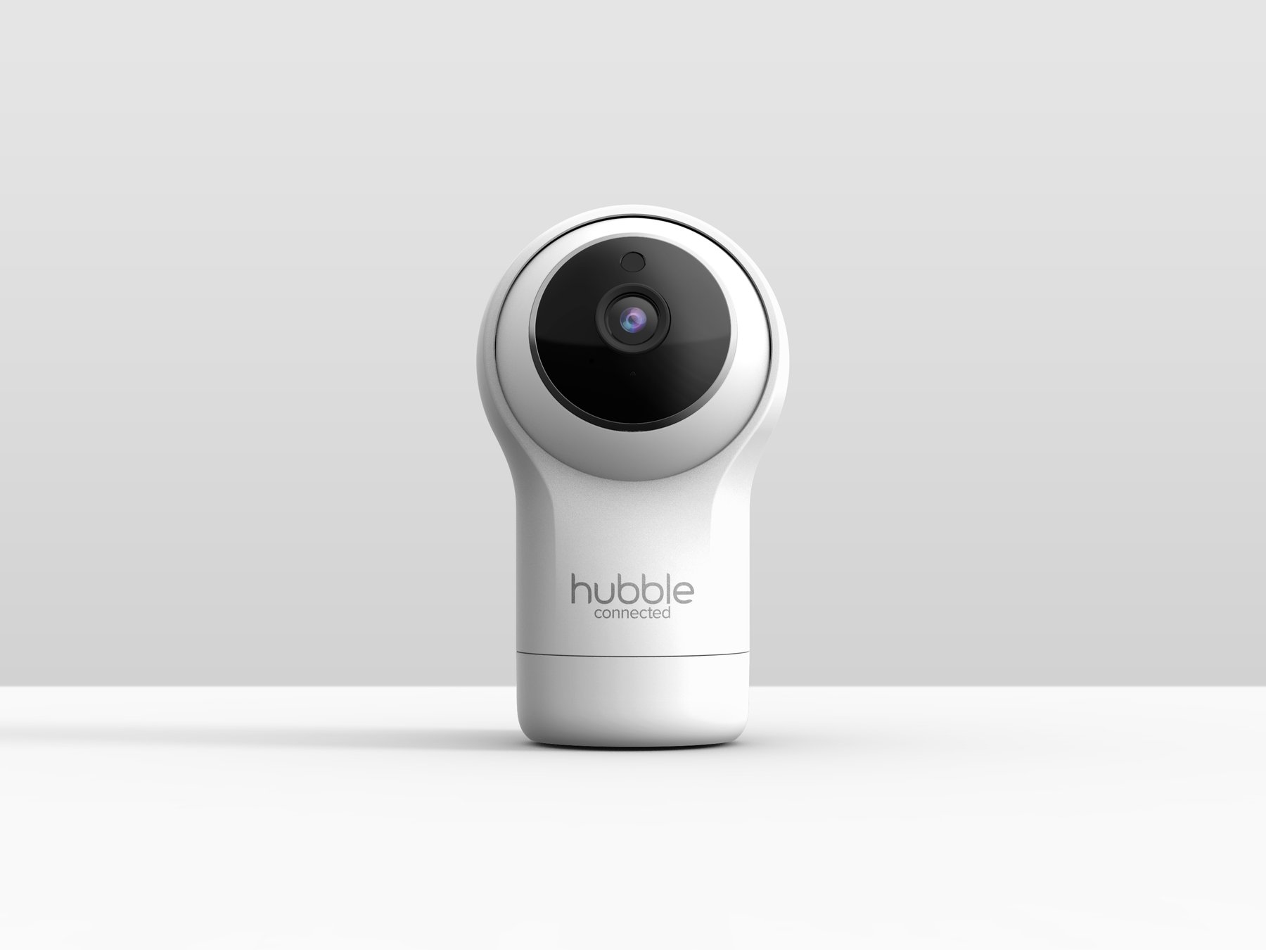 Nursery Pal Glow camera shown at two pan positions